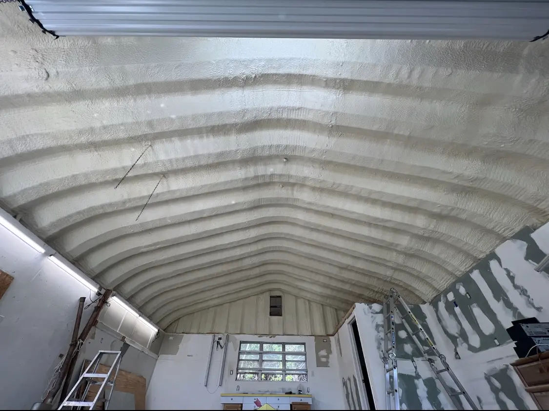Spray polyurethane foam applied to the underside of a metal roof deck in Orangetree